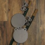 Two 1/2" AR500 8" Gongs and two sets of T-Post Hangers.T-posts not included.