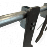 Close-up of Magnum Target KYL Rack hanger showing AR500 mounting hardware and free-swinging mechanism